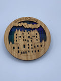Glamis Castle Round wooden coaster (assorted tartan background)
